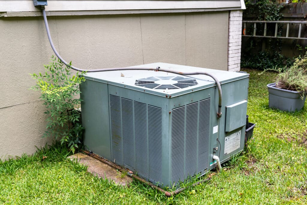 Package Air Conditioner system next to a home.